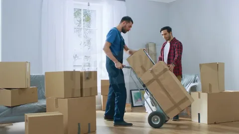 Family packing boxes with BetterMoves movers for a smooth and stress-free home relocation